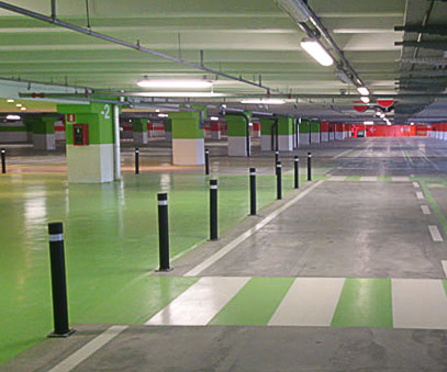 Green A-Flex B bollards with plate installed black parking